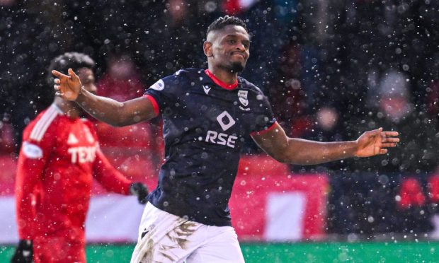 Akil Wright celebrates after scoring an outstanding goal against Aberdeen.