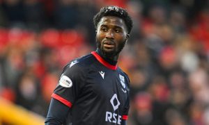 midfielder Nohan Kenneh standing while playing for Ross County FC