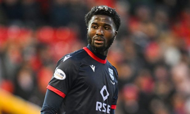 midfielder Nohan Kenneh standing while playing for Ross County FC