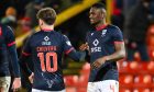 Goalscorers Akil Wright and Noah Chilvers celebrate Ross County's victory over Aberdeen.