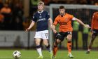 Dundee's Lyall Cameron (L) and Dundee United's Ross Docherty in action during a Premiership match. Image: SNS.