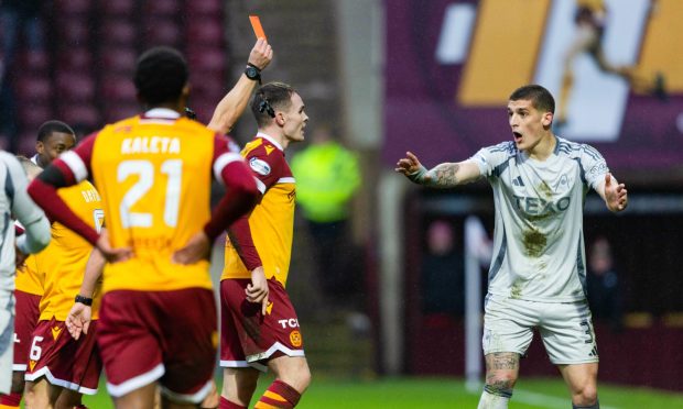 Aberdeen's Slobodan Rubezic is shown a red card by referee Nick Walsh following a confrontation with Motherwell's Tony Watt. Image: SNS