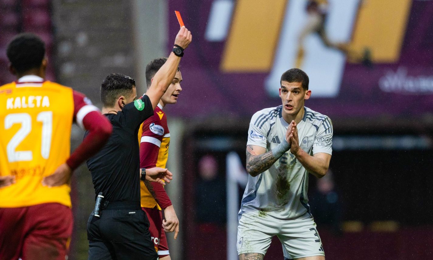 Aberdeen's Slobodan Rubezic is shown a red card by referee Nick Walsh following a confrontation with Motherwell's Tony Watt. Image: SNS.