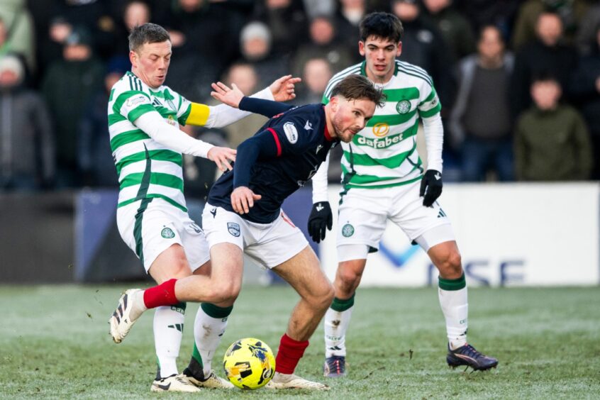 Celtic captain Callum McGregor and Ross County's Noah Chilvers in action