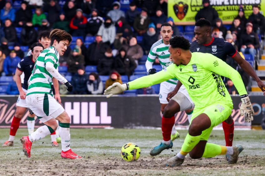 Ross County goalkeeper Jordan Amissah makes a save from Celtic's Kyogo Furuhashi in the SPFL Premiership match at the Global Energy Stadium, Dingwall, on January 11, 2025. 