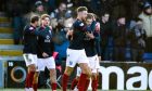 Ross County striker Jordan White, centre, celebrates after his penalty levelled the game against Celtic.