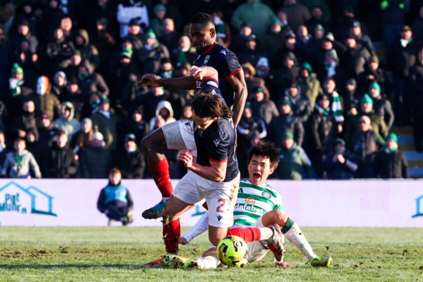 Celtic are awarded a penalty after Ross County's James Brown fouls Celtic's Yang Hyun-Jun in the box.