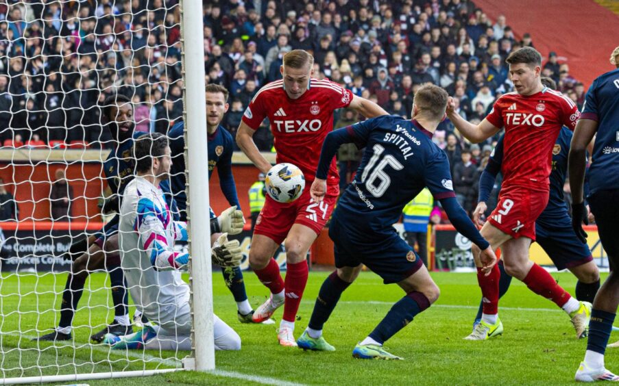 Hearts' keeper Craig Gordon saves a close range shot from Aberdeen's Kristers Tobers at the near post during a Premiership match at Pittodrie. Image: SNS