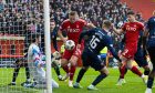 Hearts' keeper Craig Gordon saves a close range shot from Aberdeen's Kristers Tobers at the near post during a Premiership match at Pittodrie. Image: SNS