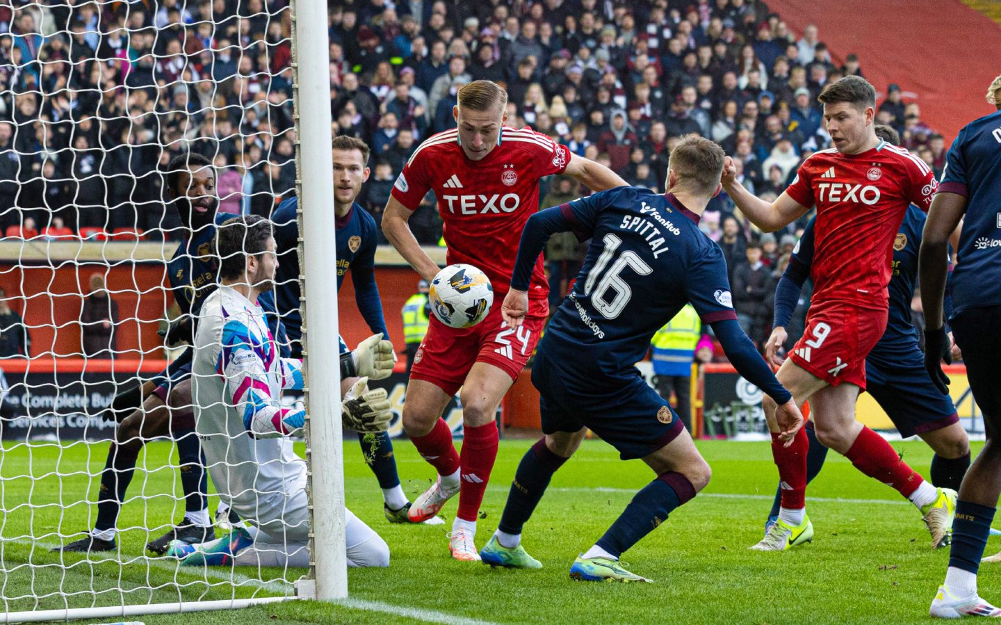 Hearts' keeper Craig Gordon saves a close range shot from Aberdeen's Kristers Tobers at the near post during a Premiership match at Pittodrie. Image: SNS 