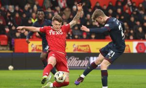 Aberdeen's James McGarry (L) and Hearts' James Wilson in action. Image SNS