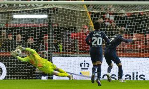 Aberdeen's Ross Doohan saves a penalty from Hearts' Jorge Grant. Image: SNS