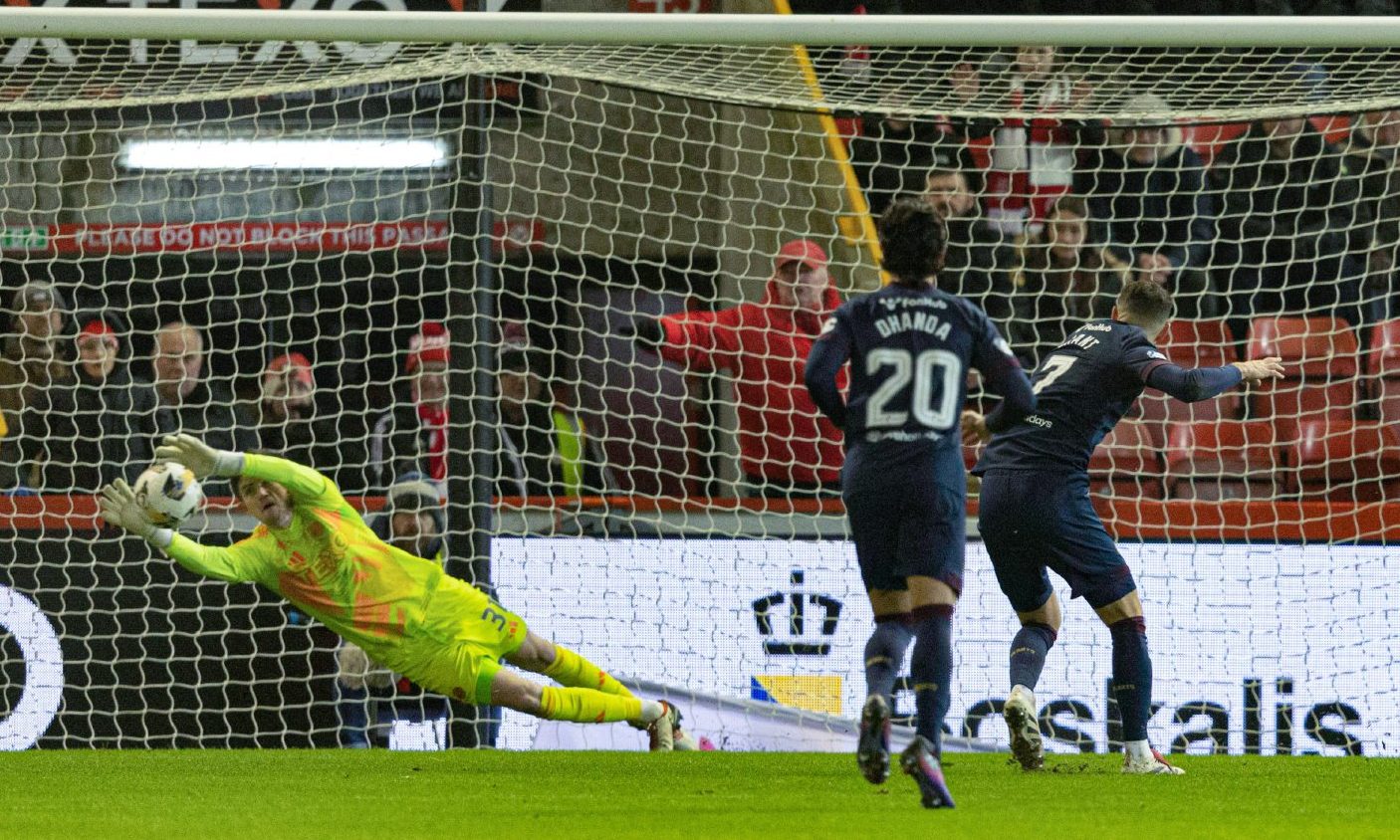 Aberdeen's Ross Doohan saves a penalty from Hearts' Jorge Grant. Image: SNS