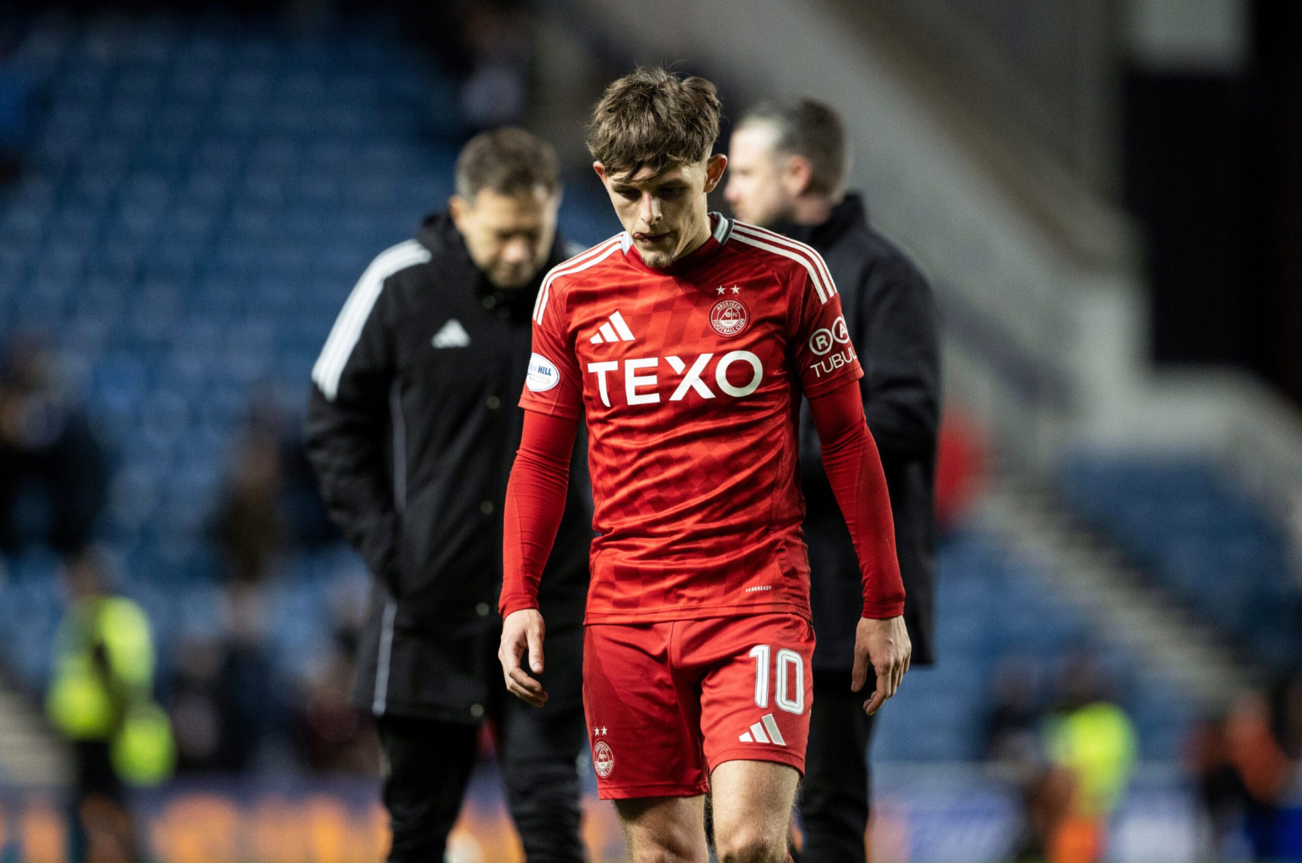 Aberdeen's Leighton Clarkson looks dejected at full time in the 3-0 loss to Rangers at Ibrox. Image: SNS 