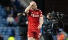 Aberdeen's Nicky Devlin looks dejected at full time after defeat to Rangers. Image: SNS.