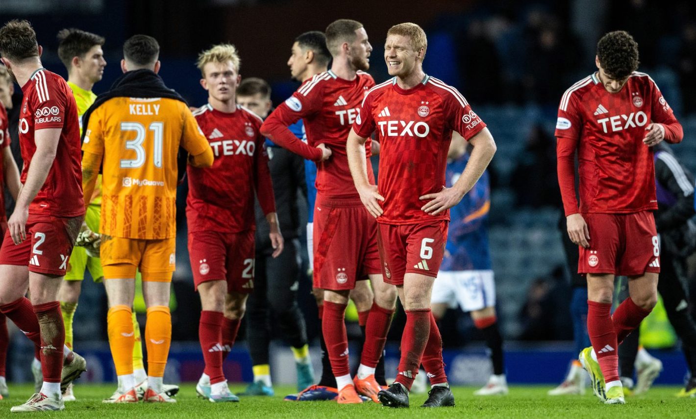 Aberdeen's Sivert Heltne Nilsen looks dejected at full time after the 3-0 loss to Rangers at Ibrox. Image: SNS