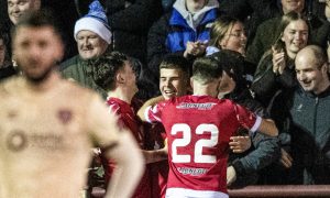 Scott Bright, centre, is mobbed by his Brechin team-mates after scoring against Hearts. Picture by SNS.