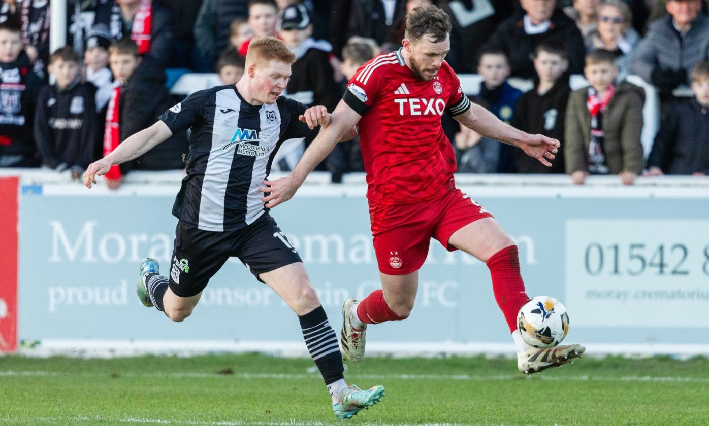 Elgin's Owen Cairns and Aberdeen's Nicky Devlin in action in the Scottish Cup fourth round. Image: SNS