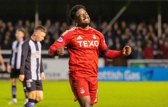 Aberdeen's Duk celebrates after scoring to make it 3-0 against Elgin City. Image; SNS