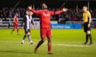 Aberdeen's Duk celebrates after scoring to make it 3-0 against Elgin City. Image; SNS