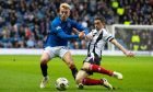 Fraserburgh captain Willie West, right, challenges Ross McCausland of Rangers in the Scottish Cup clash at Ibrox.