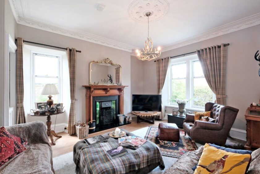 Traditional Lounge with tartan blankets and a Victorian look