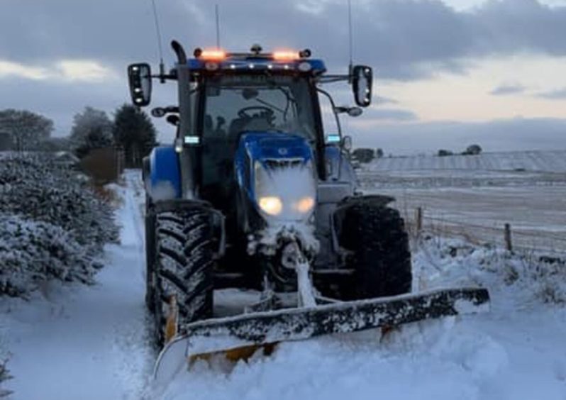 Andrew Sharp sent us this photo of his tractor out clearing snow. 