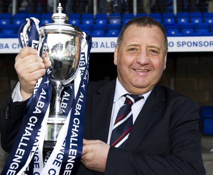 Jimmy Calderwood with the BBC Alba Challenge Cup after his Ross County side beat Queen of the South 2-0 in the final on April 10, 2011, at McDiarmid Park, Perth.