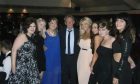 Ariane Davidson and other attendees pictured with the footballer at the Denis Law Charity Ball 2013.