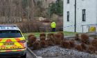 Police on the scene at the River Dee yesterday. Image: Jasperimage.