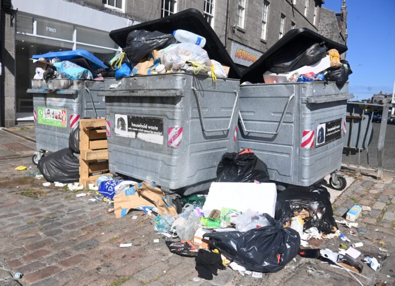 Bins overflowing on the Castlegate in Aberdeen during national strike action in 2022. Image: Chris Sumner/DC Thomson