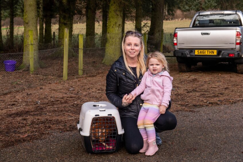 Nicola Boyne, with young Georgia, at the hen rehoming event near Inverurie.