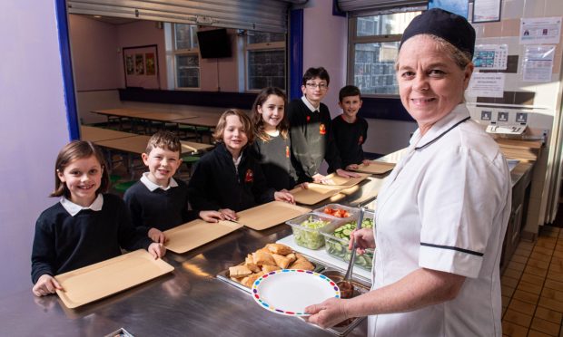 Culter Primary School dinner lady Brenda Zietsman loves her job cooking 300 meals a day. Image: Darrell Benns/DC Thomson