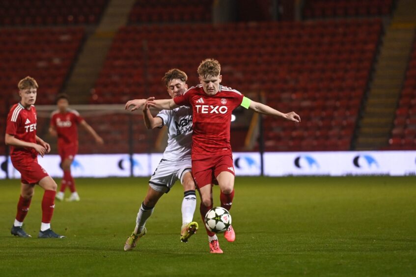 Aberdeen FC midfielder Alfie Stewart in possession for the Dons in the UEFA Youth League - Domestic Champions Path round two against Puskas Akademia FC on October 23, 2024 at Pittodrie Stadium, Aberdeen. 