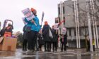 Council staff protested outside Marischal College and Aberdeen Town House in 2024. Image: Darrell Benns/DC Thomson