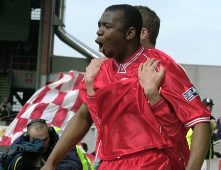 Leon Mike celebrates scoring for Aberdeen against Livingston in 2002. 