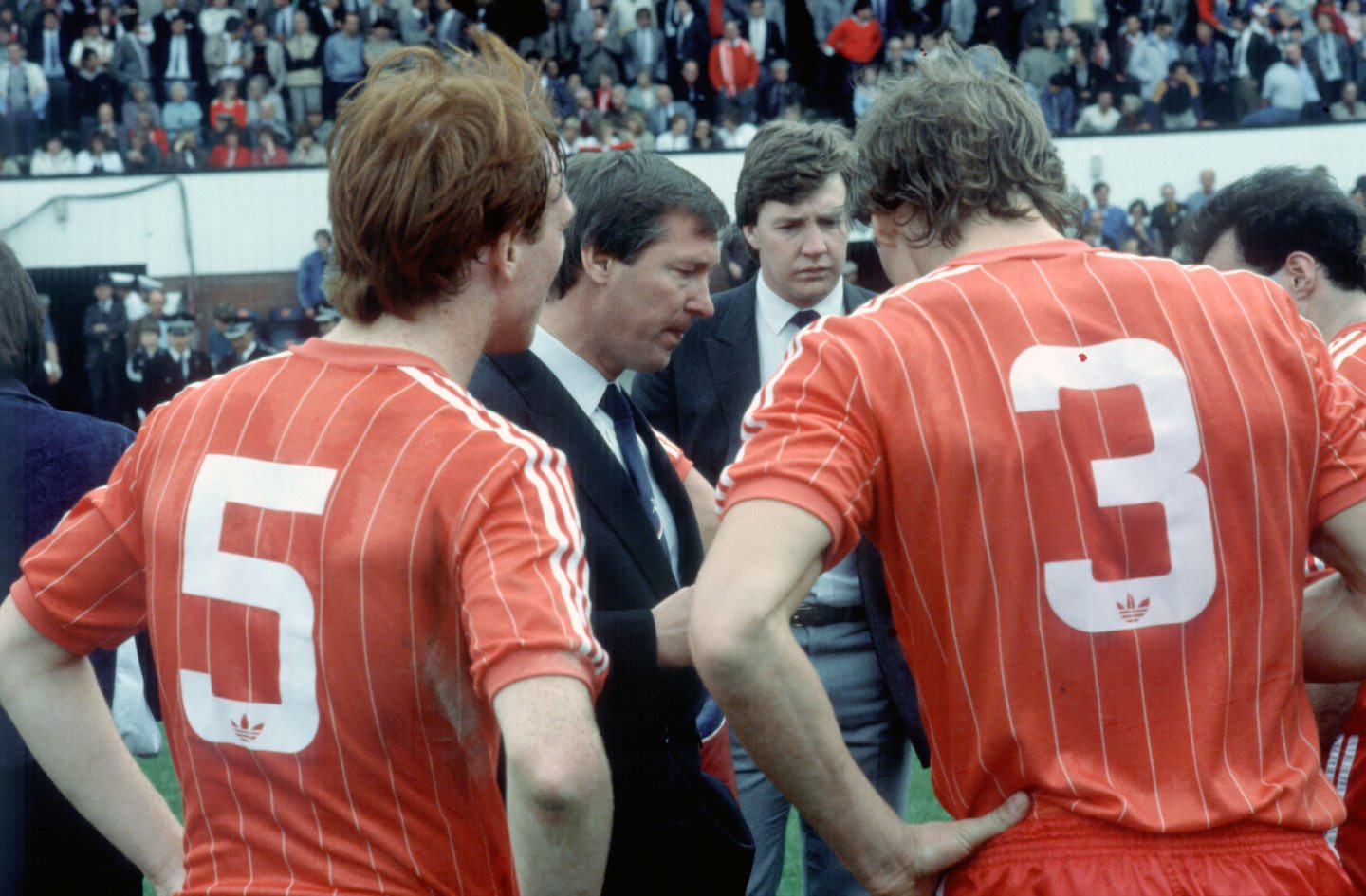 Manager Alex Ferguson (2nd from left) gives his players including Alex McLeish (left) a pre game team talk. Image: SNS 