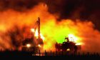 Livestock burning on a farm in Lockerbie, the first in Scotland to be affected by the foot-a