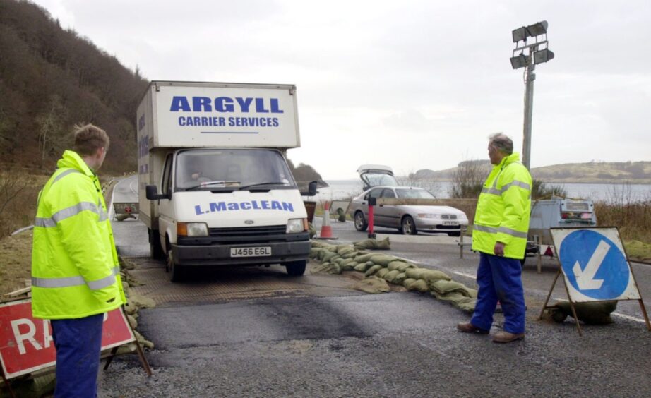 Traffic crossing disinfectant pads on the Argyll/Highland border, at Duror, in 2001.