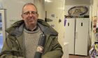 Rev Richard Coles posing with a black pudding. Image: X.