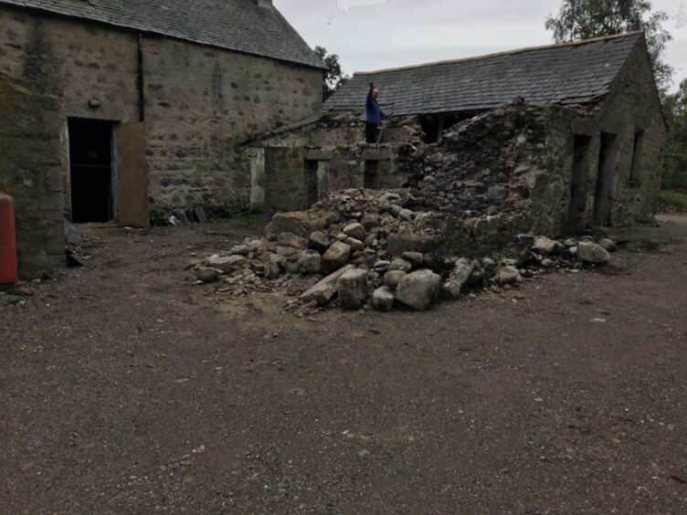 Broken wall outside Inverarnie Lodge.