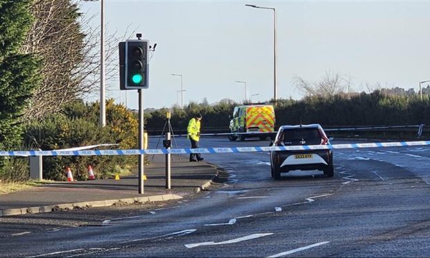 Officers say "enquiries are ongoing" to establish the full circumstances of the crash near to the Inshes roundabout in Inverness. Image: Michelle Henderson/DC Thomson.