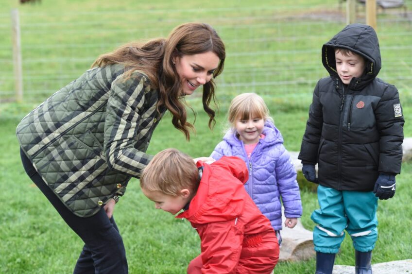 Kate has fun with some youngsters at Brodieshill Farm during a visit by the Duke and Duchess of Rothesay