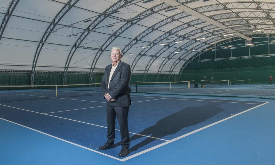 Sandy Adam on indoor tennis court. 