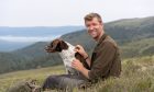 Jack Ward, stalker at Cairngorms Connect, and his dog Ruadh. Image: Rupert Shanks / Cairngorms Connect