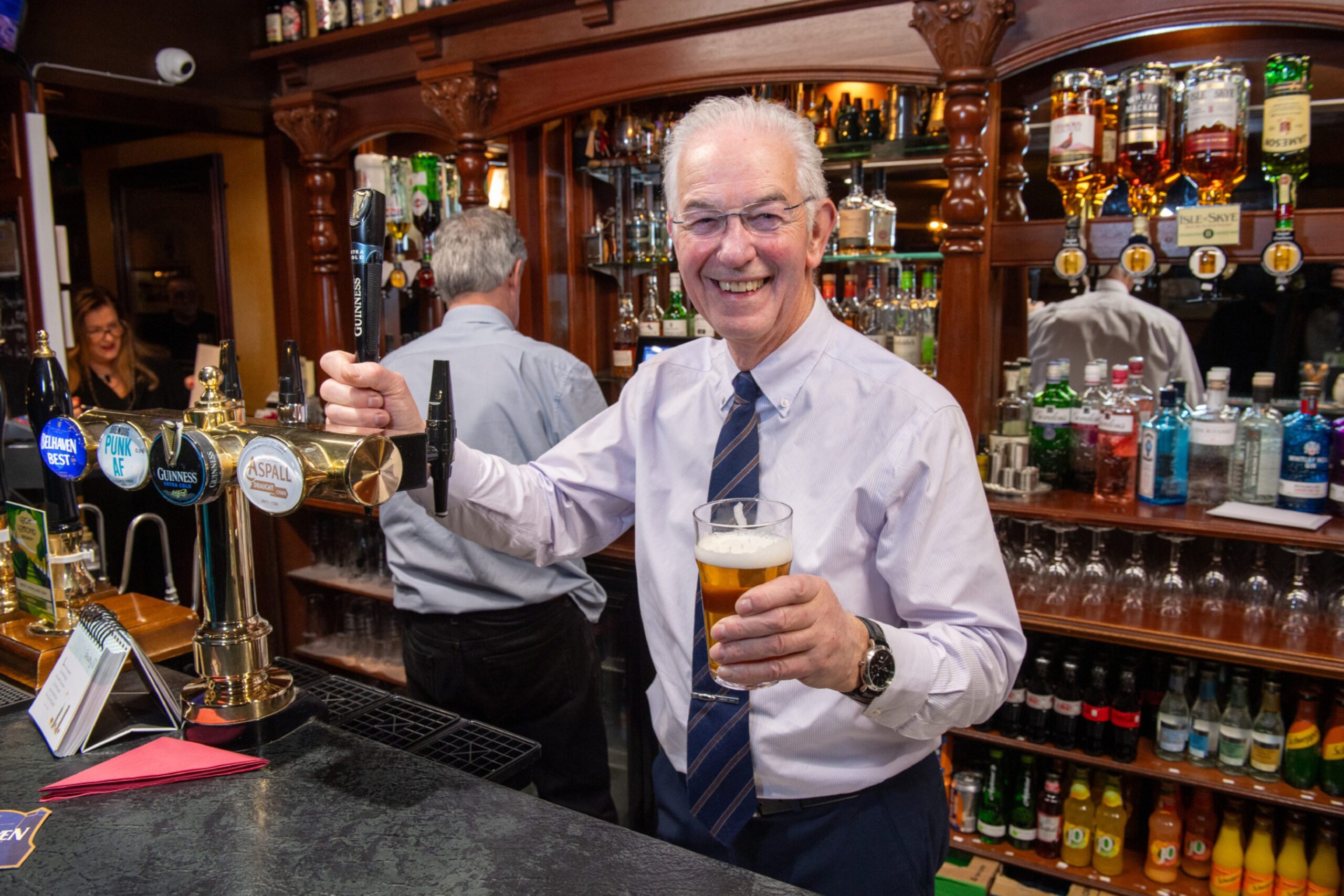 Stuart Singer pulling a pint at the Redgarth bar