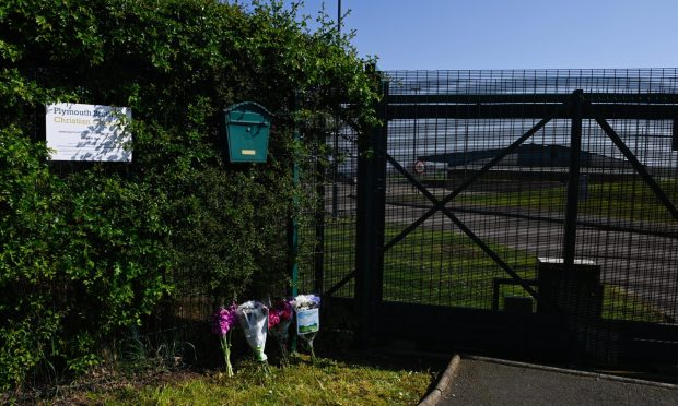 Flowers outside church gate in Balmedie