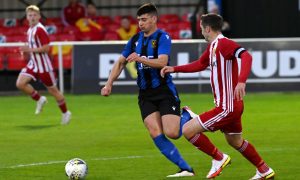 Formartine United's Glenn Murison, left, in action for former club Huntly against Formartine.