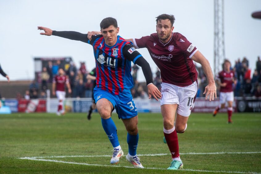 Charlie Reilly, left, in action for Inverness Caledonian Thistle against Arbroath's Keith Watson on October 5, 2024, at Gayfield Park, Arbroath.