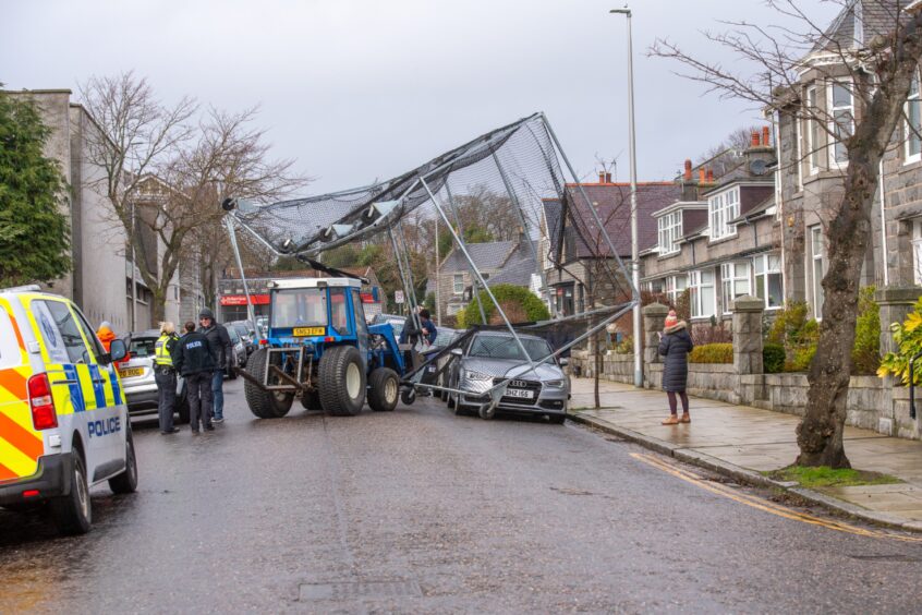 Tractor recovering cricket cage